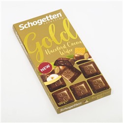 Шоколад молочный Schogetten Gold с дроблёным фундуком и кусочками вафель, 100 г